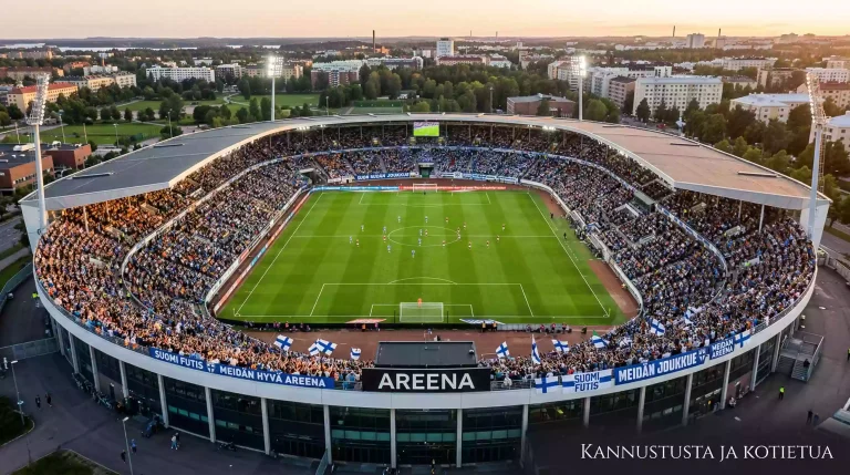 Taynna oleva jalkapallostadion kotijoukkueen fanien kanssa